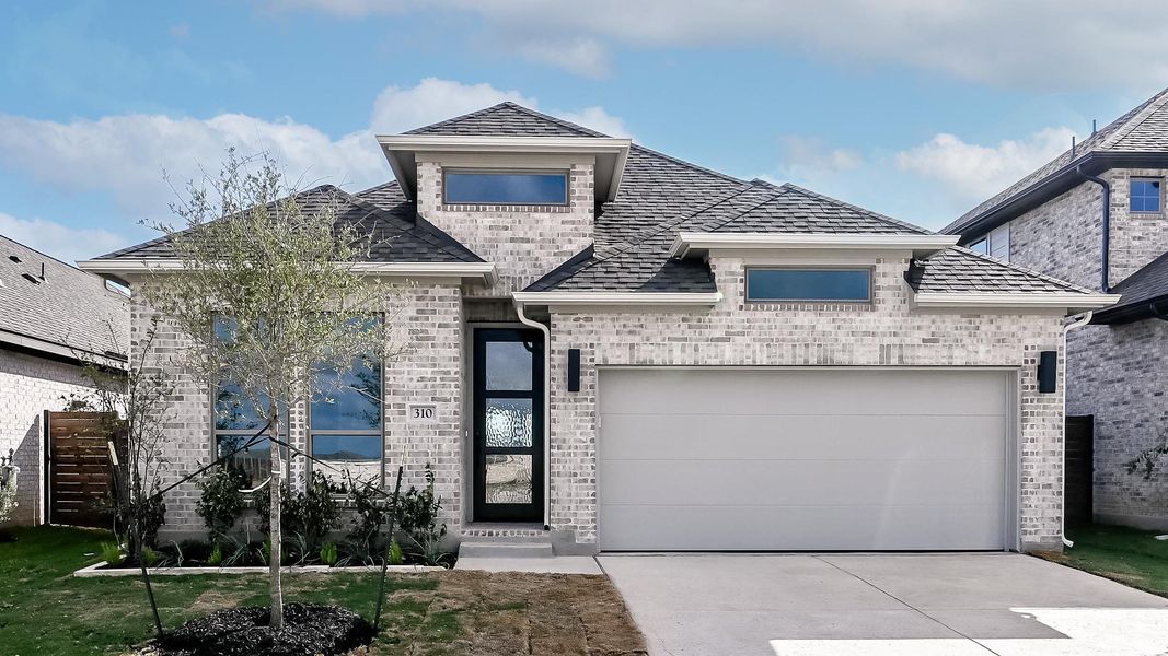 Front exterior of a new home in Juniper Springs, Lockhart, TX, highlighting curb appeal (Image 18). Front exterior of a new home in Juniper Springs, Lockhart, TX, highlighting curb appeal (Image 18).
