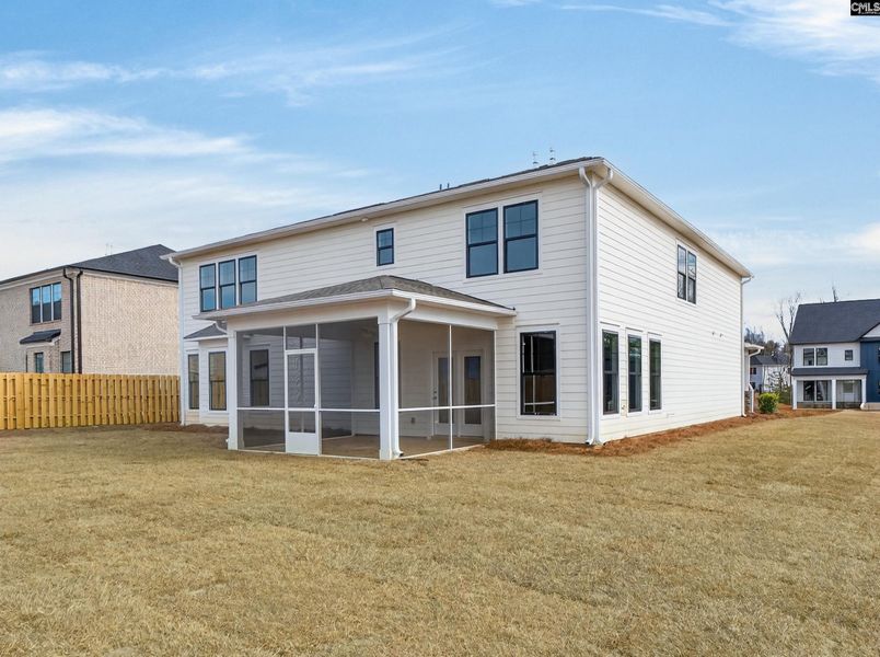 Exterior details and patio area of a home in Collins Cove, Chapin (Image 32).