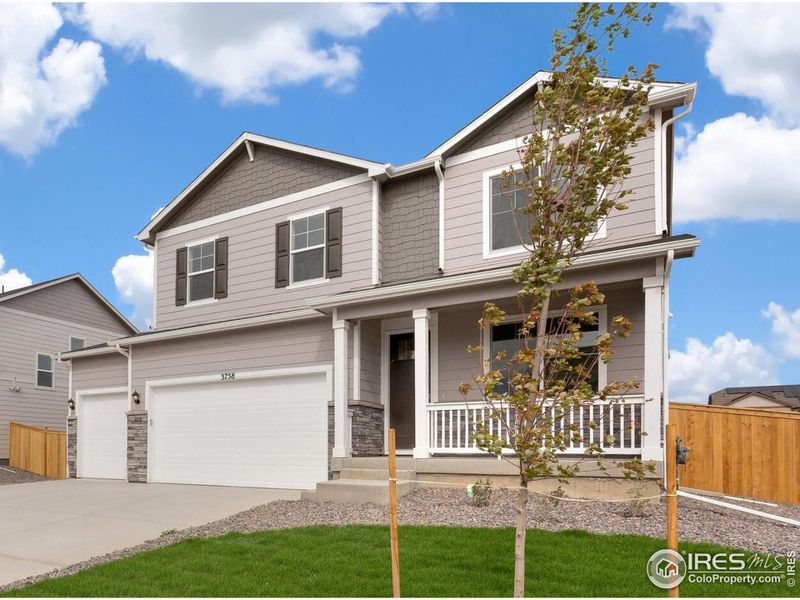 Front exterior of a new home in Lakeside Canyon, Mead, CO, highlighting curb appeal (Image 2). Front exterior of a new home in Lakeside Canyon, Mead, CO, highlighting curb appeal (Image 2).