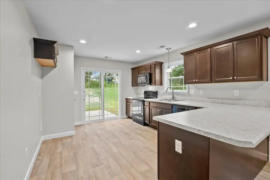 Representative furnished interior of a home built from the Lyman by Enchanted Homes in Lonesome Dove, San Antonio (Image 7).
