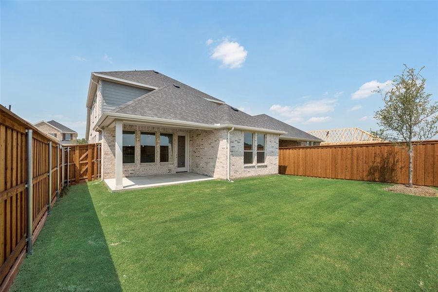 Front exterior of a new home in Spiritas Ranch, Little Elm, TX, highlighting curb appeal (Image 2). Front exterior of a new home in Spiritas Ranch, Little Elm, TX, highlighting curb appeal (Image 2).