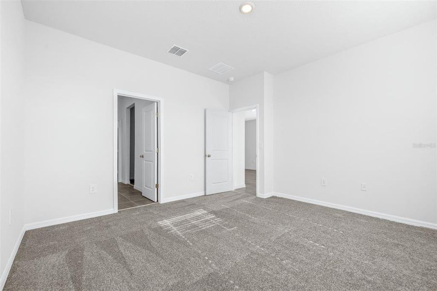 Spacious, unfurnished interior of a new home in The Grove at Stuart Crossing - Premier Series, Bartow (Image 30).