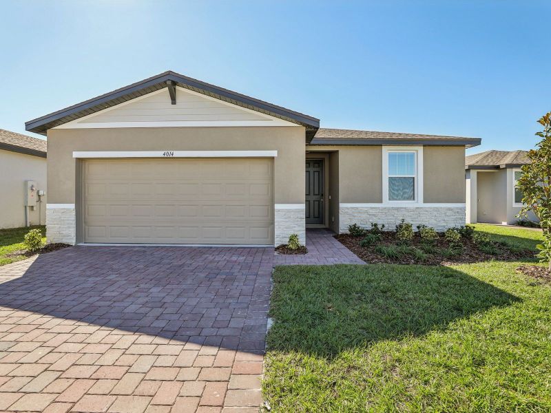 Front exterior of a new home in Lake Deer Estates - Signature Series, Poinciana, FL, highlighting curb appeal (Image 1).