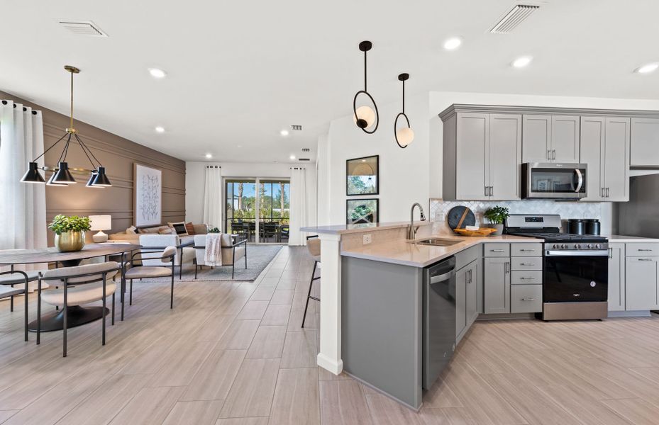 Representative furnished interior of a home built from the Cascadia by DiVosta in BeachWalk by Manasota Key, Englewood (Image 40).