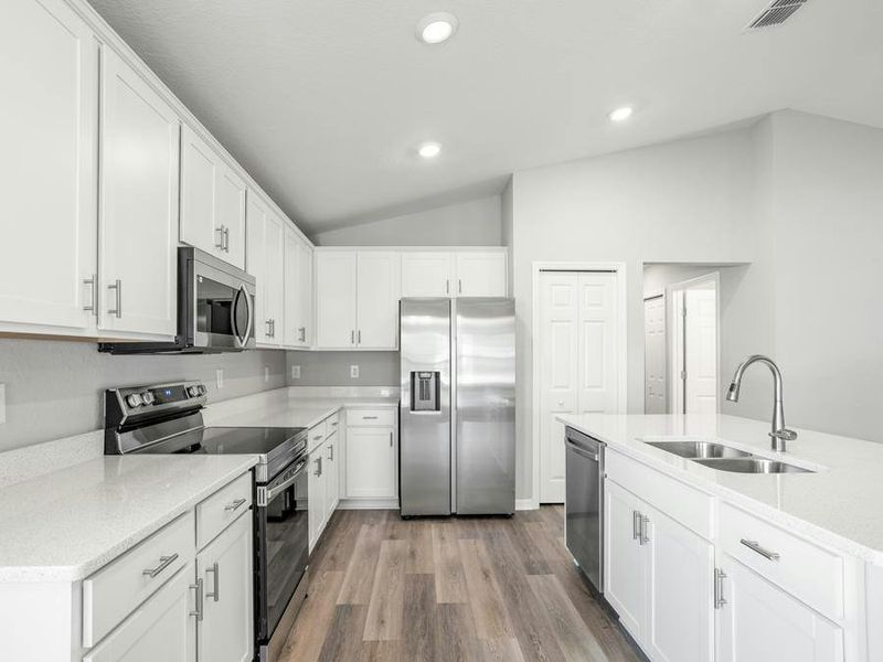 Enjoy the storage convenience of a pantry and 36-inch cabinets.