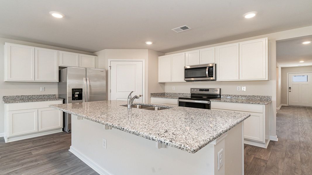 Furnished interior view inside a new home in Stanbury Creek, Supply (Image 6).
