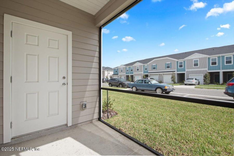 Exterior details and patio area of a home in Hardwick Farms: Hardwick Farms - Townhome Collection, Jacksonville (Image 26).