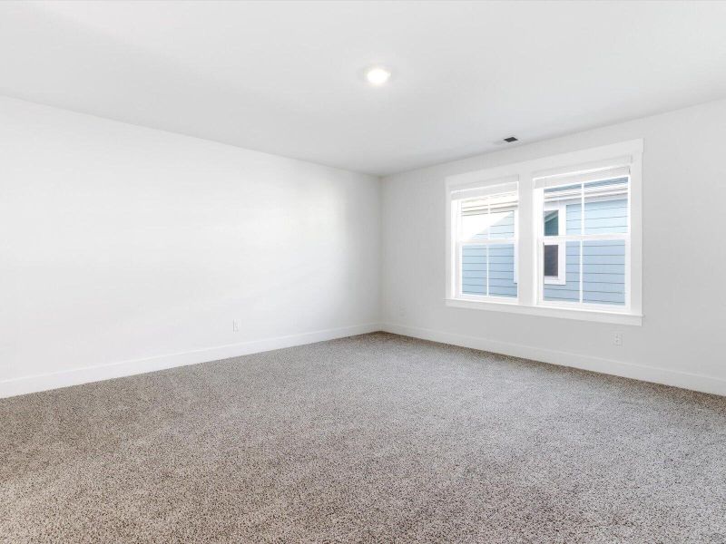Spacious, unfurnished interior of a new home in The Coves at Lakes of Cane Bay, Summerville (Image 23).