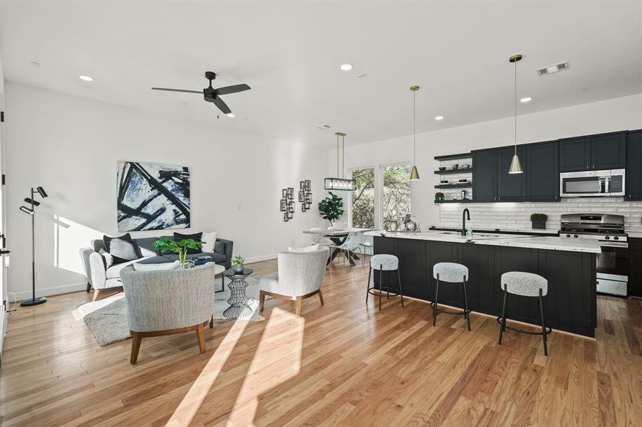 Welcome to the main living room space. This second floor is perfect for entertaining or quiet relaxation, and is where style meets sophistication in the heart of your new home!