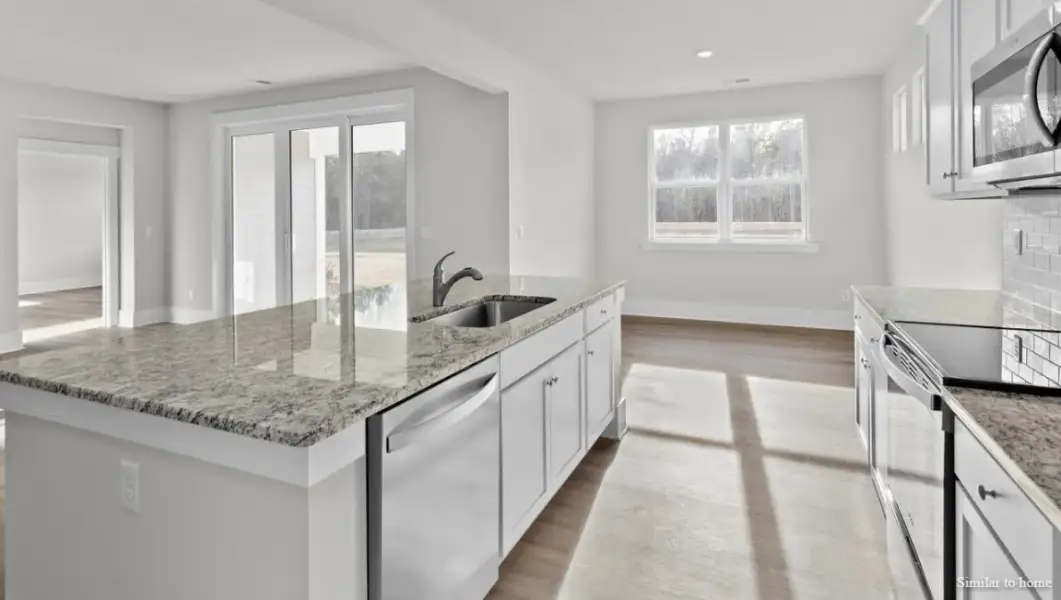 Furnished interior view inside a new home in The Highlands at Cedar Hill Landing, Navassa (Image 9).
