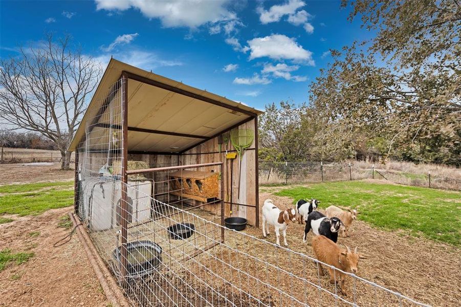 View of outbuilding with a rural view