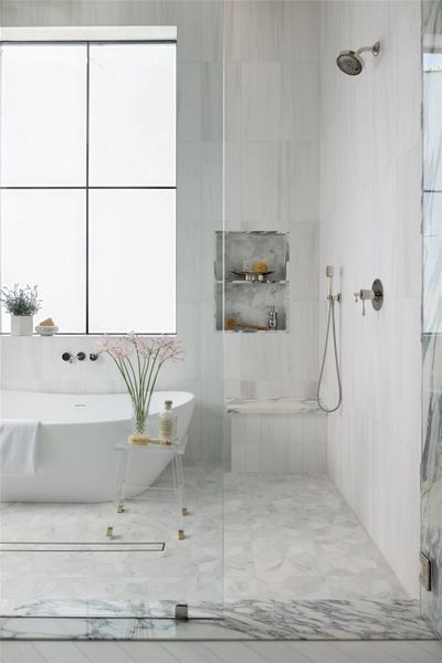 Double shower doors with double shower fixtures on opposite ends Double shower doors with double shower fixtures on opposite ends