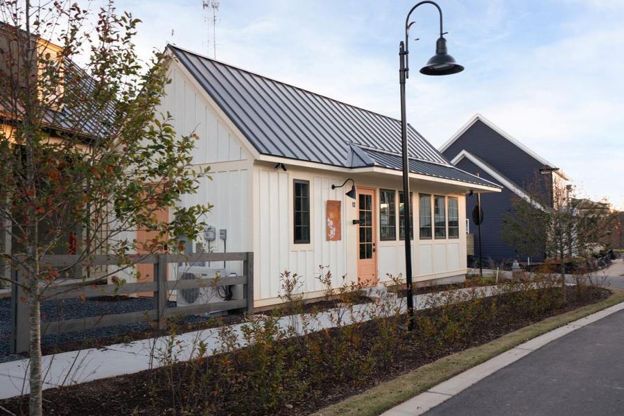 Front exterior of a new home in Harmony, Auburn, GA, highlighting curb appeal (Image 24). Front exterior of a new home in Harmony, Auburn, GA, highlighting curb appeal (Image 24).