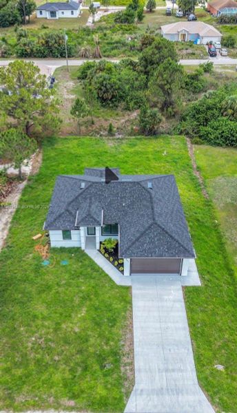 Front exterior of a new home in , Lehigh Acres, FL, highlighting curb appeal (Image 23).