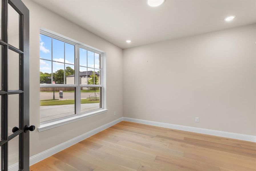 Empty room featuring light hardwood / wood-style floors and a wealth of natural light