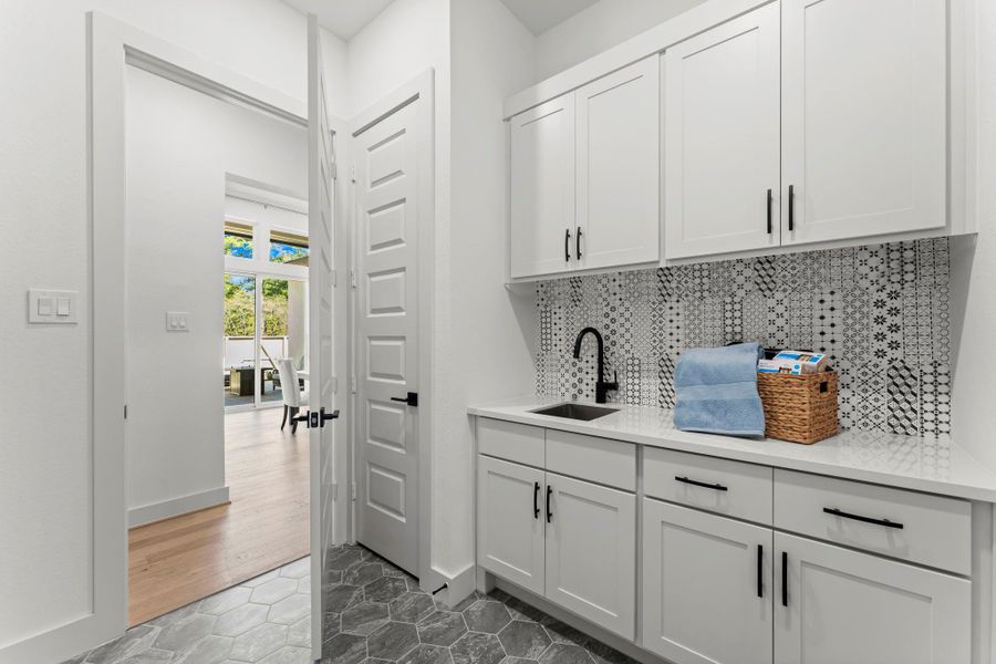 Fully functional Utility Room with a sink and plenty of storage Fully functional Utility Room with a sink and plenty of storage