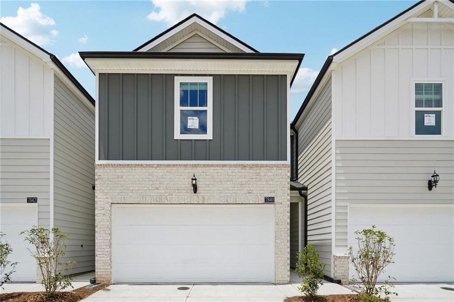 Front exterior of a new home in Artisan Walk, Fairburn, GA, highlighting curb appeal (Image 22).