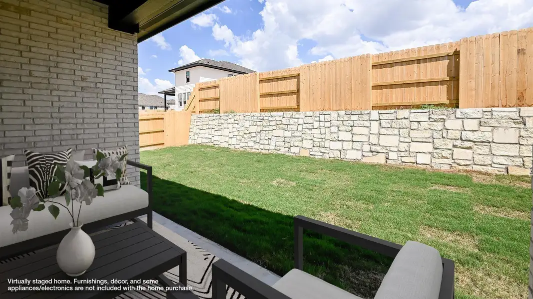 Fenced backyard with a patio Fenced backyard with a patio