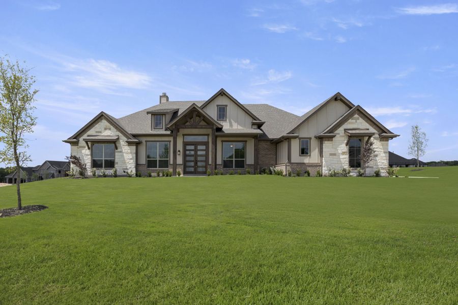 Front exterior of a new home in The Meadows, Gunter, TX, highlighting curb appeal (Image 27). Front exterior of a new home in The Meadows, Gunter, TX, highlighting curb appeal (Image 27).