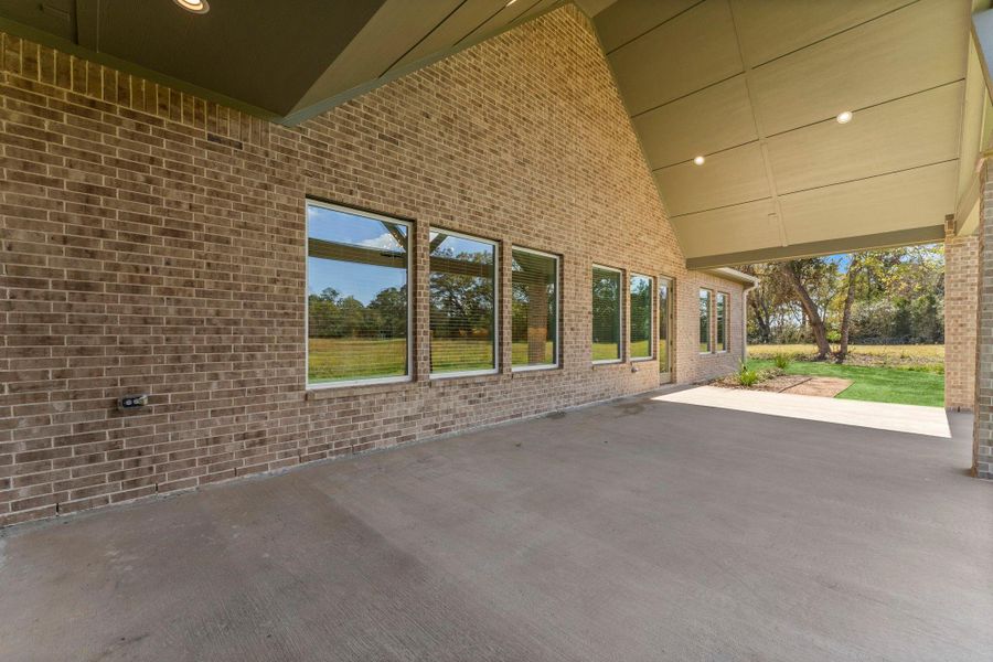 Exterior details and patio area of a home in Homestead Hill, New Waverly (Image 16).