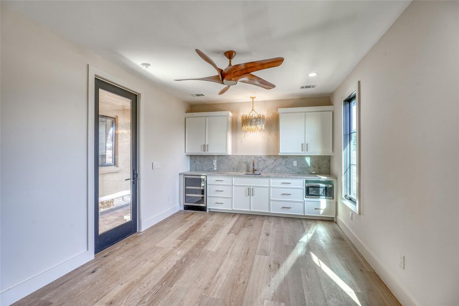 Guest quarters with own private entrance features very spacious main room / bedroom with sink, beverage fridge, microwave & large full bath with walk-in shower & walk-in closet.