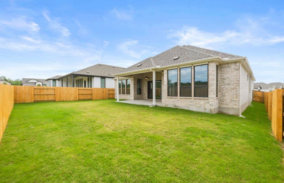 Exterior details and patio area of a home in 6 Creeks, Kyle (Image 18).