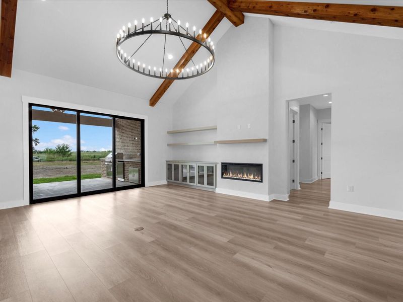 Extremely tall ceilings with an open concept living space, and amazing sliding doors that lead to the outdoor kitchen.