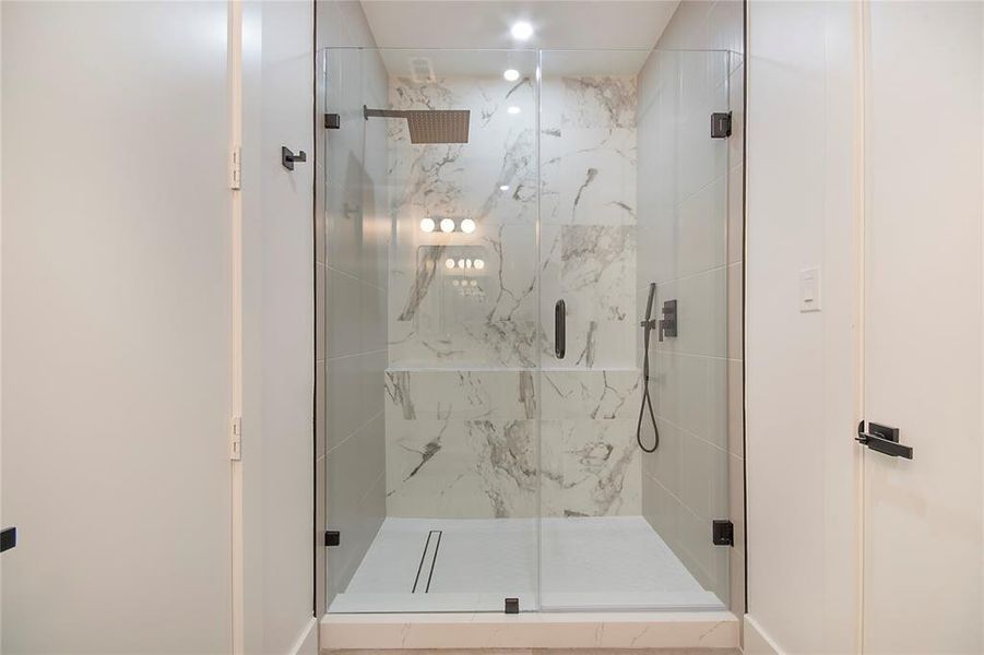Full bathroom featuring a marble finish shower Full bathroom featuring a marble finish shower