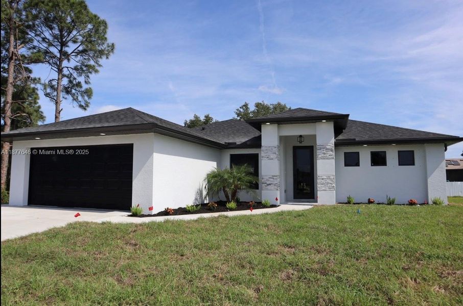 Front exterior of a new home in , Lehigh Acres, FL, highlighting curb appeal (Image 9).