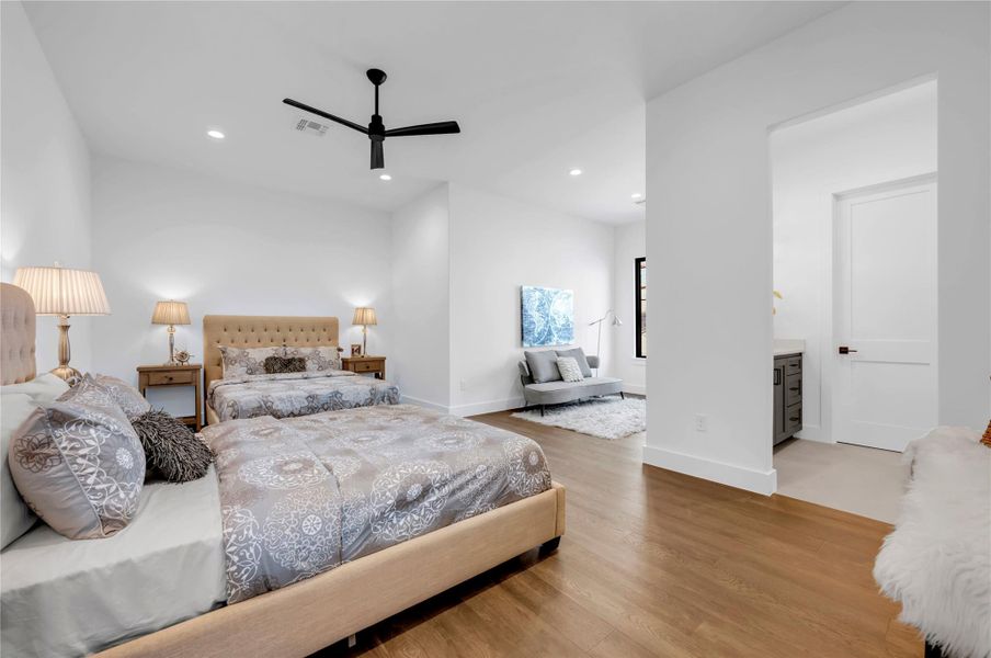 Bedroom featuring recessed lighting, light wood-type flooring, and a ceiling fan