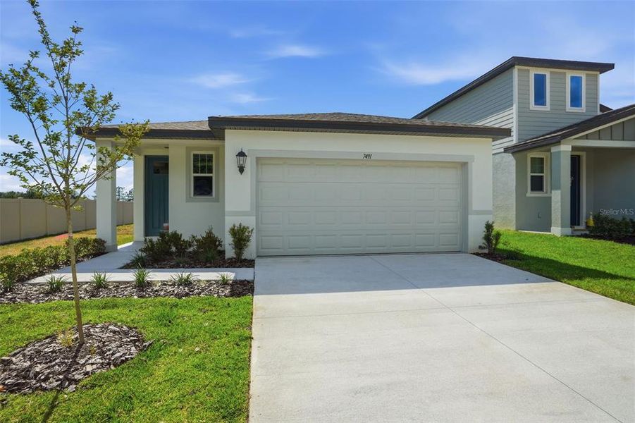 Front exterior of a new home in Leyland Preserve - Premier Series, Brooksville, FL, highlighting curb appeal (Image 31).