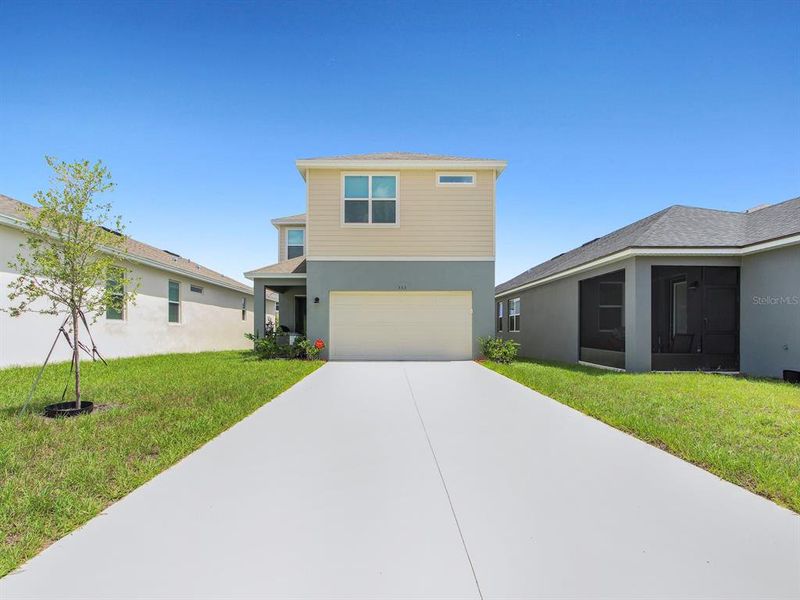 Front exterior of a new home in , Groveland, FL, highlighting curb appeal (Image 26).