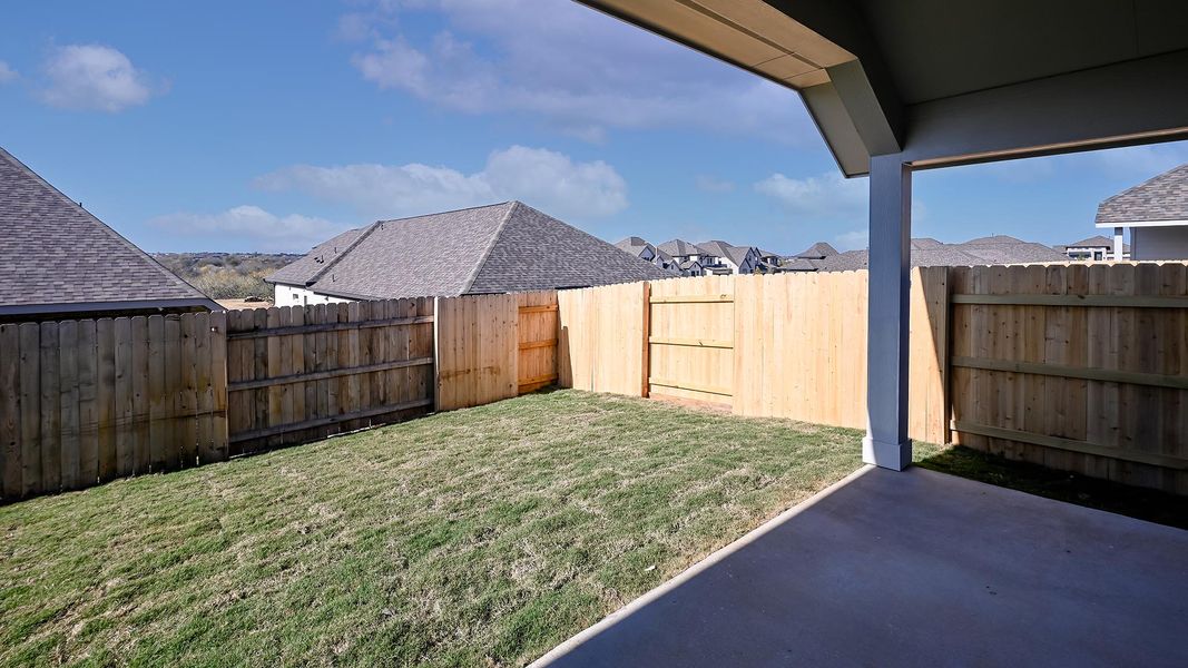 Exterior details and patio area of a home in Crosswinds 40', Kyle (Image 2).
