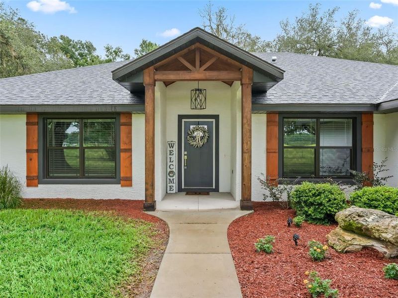 Front exterior of a new home in , Bushnell, FL, highlighting curb appeal (Image 18).