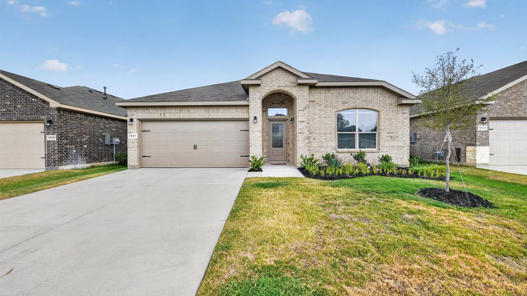 Front exterior of a new home in Legado, Cleburne, TX, highlighting curb appeal (Image 2). Front exterior of a new home in Legado, Cleburne, TX, highlighting curb appeal (Image 2).