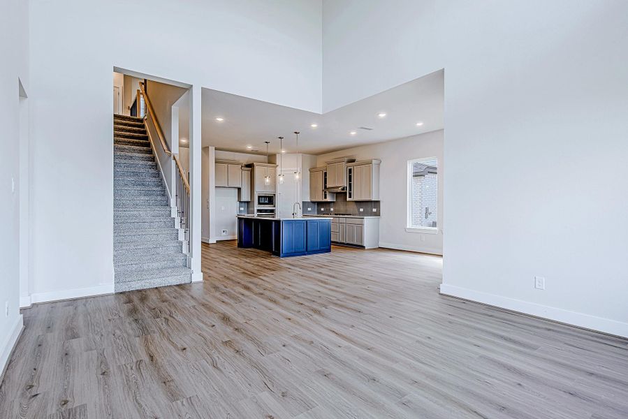 The seamless flow between the living area and kitchen is ideal for entertaining, while the upgraded finishes and clean lines tie the space together beautifully.