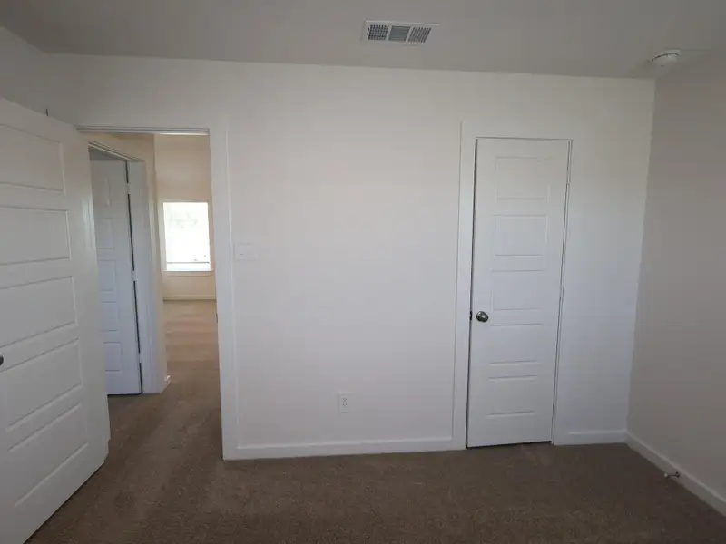 Spacious, unfurnished interior of a new home in Pinewood at Grand Texas, New Caney (Image 9).