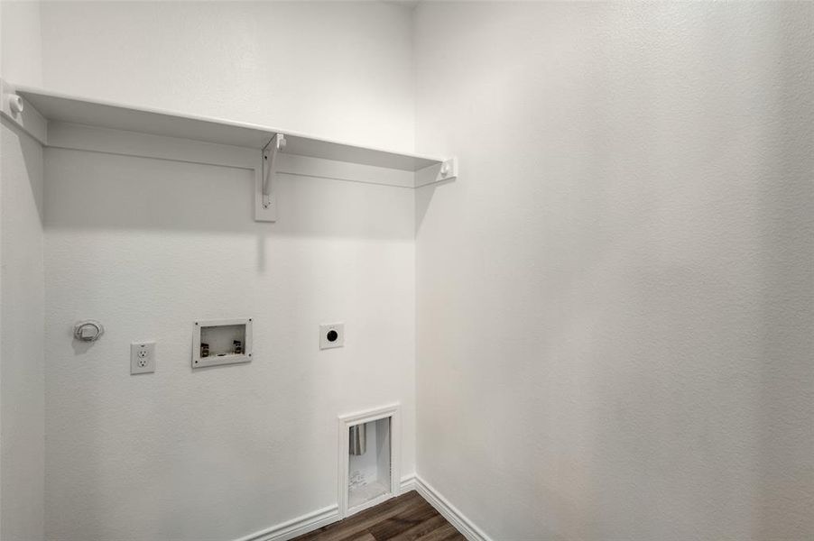 Laundry room featuring hookup for a washing machine, hardwood / wood-style flooring, and hookup for an electric dryer