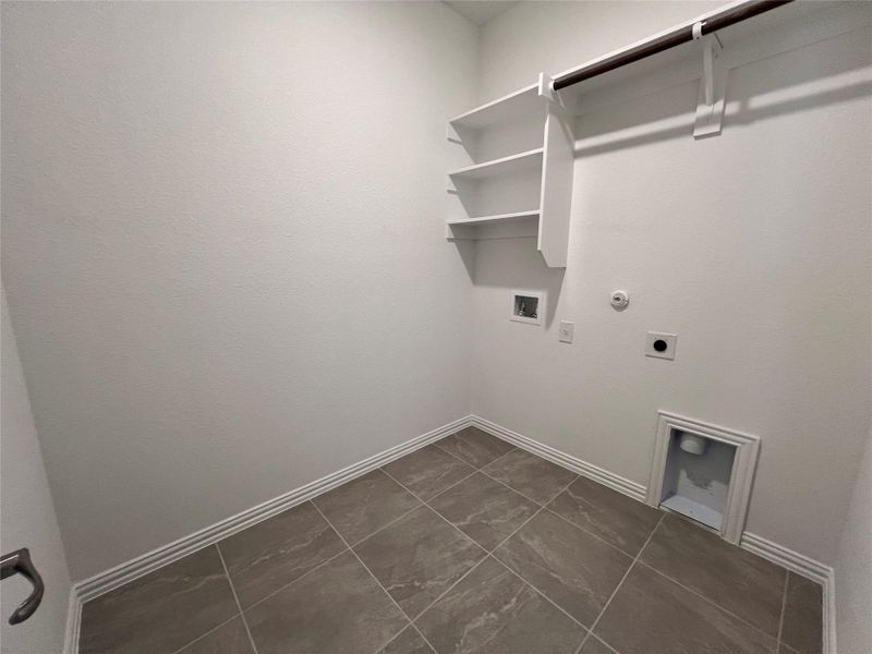 Washroom featuring gas dryer hookup, electric dryer hookup, and washer hookup