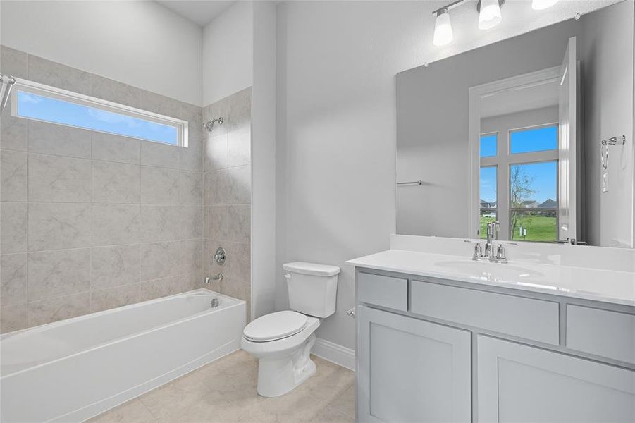 Full bath featuring vanity and shower / tub combination