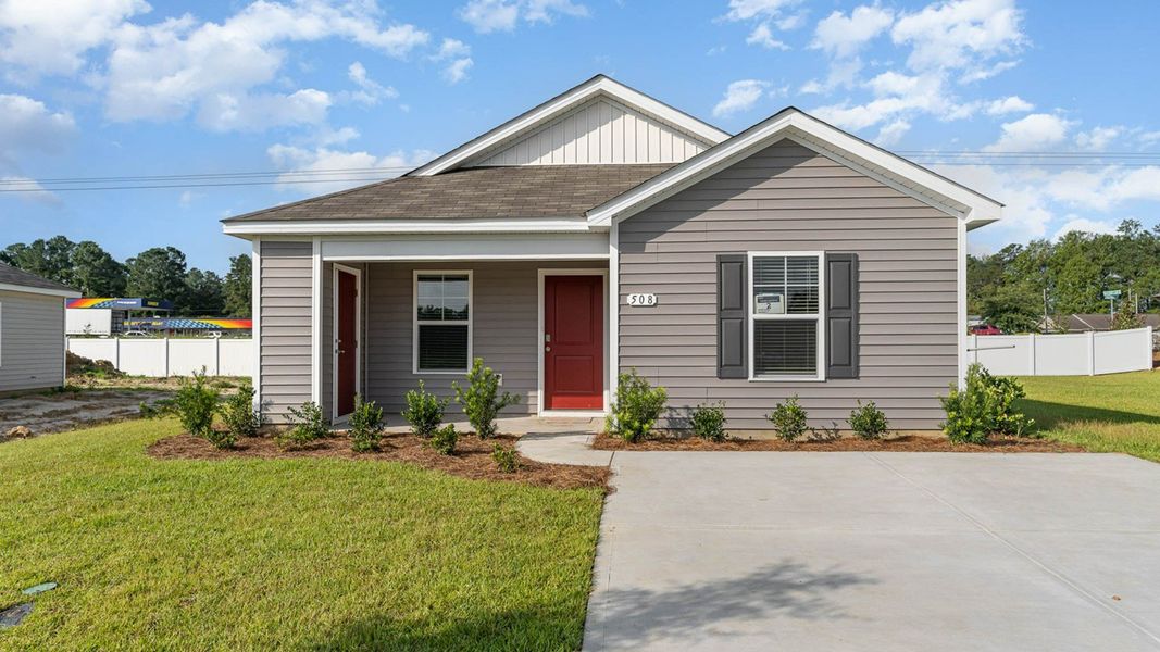 Representative exterior photo of a completed home built from the LEWIS by D.R. Horton in The Cottages at Blake Farm, Wilmington, NC (Image 3).
