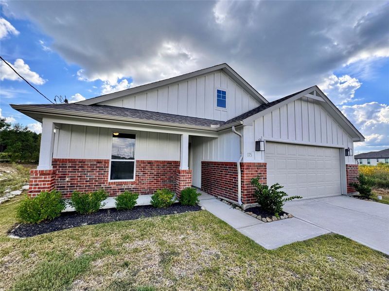 Front exterior of a new home in , Cleveland, TX, highlighting curb appeal (Image 13).