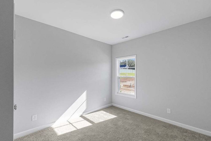 Representative unfurnished interior of a home built from the Weymouth by Caviness & Cates Communities in Bartlett Manor, Youngsville (Image 43).