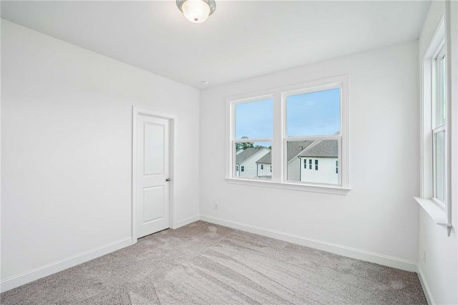 Spacious, unfurnished interior of a new home in East Harbor II at Chestatee, Dawsonville (Image 32).