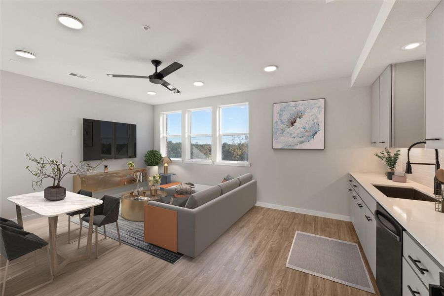 Living room featuring light wood-style flooring, ceiling fan, baseboards, and recessed lighting