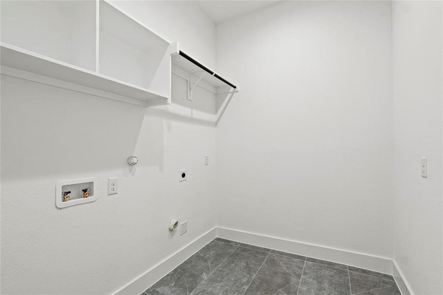 Laundry room featuring gas dryer hookup, hookup for a washing machine, and hookup for an electric dryer