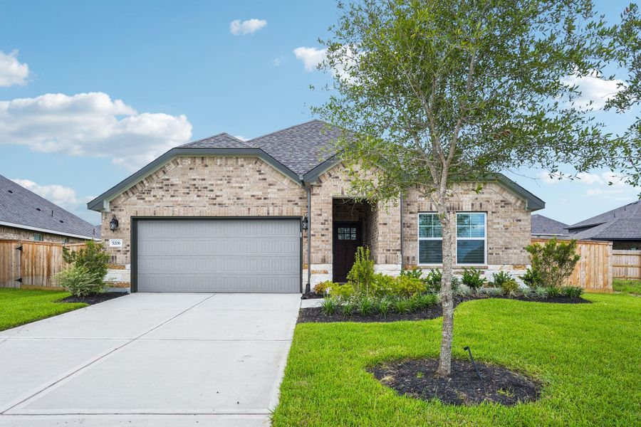 Front exterior of a new home in Massey Oaks - Premier Series, Pearland, TX, highlighting curb appeal (Image 6). Front exterior of a new home in Massey Oaks - Premier Series, Pearland, TX, highlighting curb appeal (Image 6).