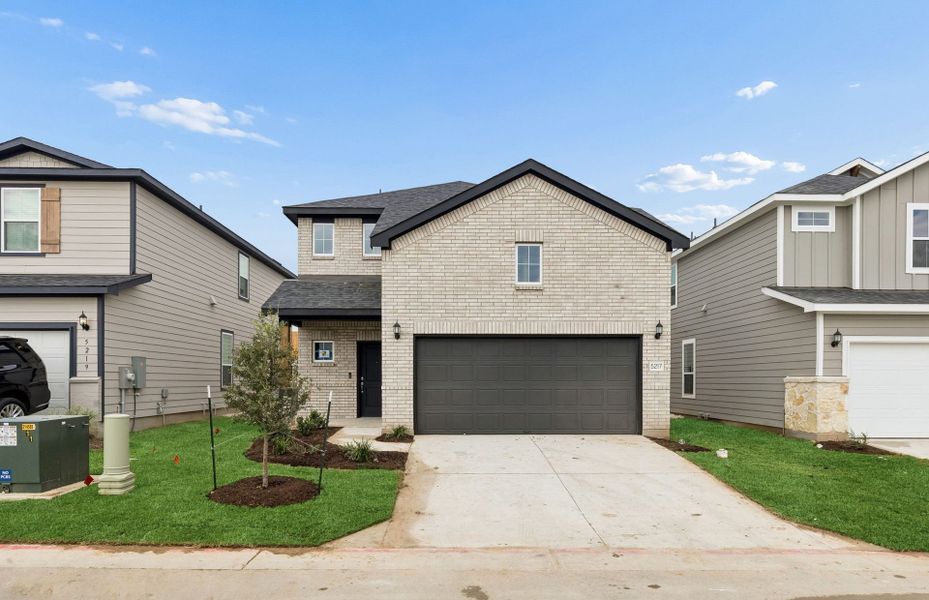 Front exterior of a new home in Cameron Place, Austin, TX, highlighting curb appeal (Image 2). Front exterior of a new home in Cameron Place, Austin, TX, highlighting curb appeal (Image 2).