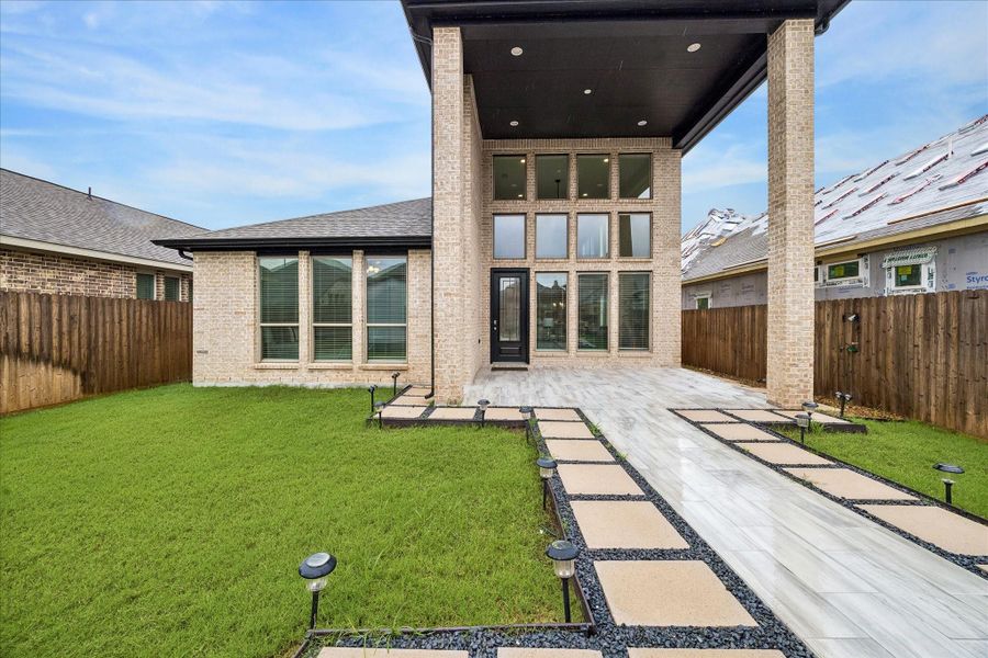 The spacious backyard offers a great mix of green space, an impressive covered patio, a sprinkler system & plenty of room to create your own outdoor retreat. With the tiki bar being removed and the base pad, electrical wiring & plumbing remaining, the space is primed for the next owner to design a custom summer kitchen, lounge area or expanded entertaining setup.