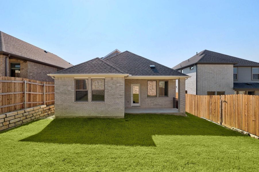 Front exterior of a new home in Lakeside at Tessera, Lago Vista, TX, highlighting curb appeal (Image 22). Front exterior of a new home in Lakeside at Tessera, Lago Vista, TX, highlighting curb appeal (Image 22).